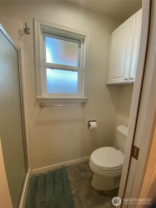 To the left is shower and toilet