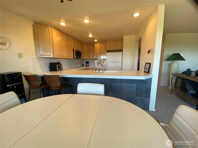 From the dining area, looking back toward the hall and kitchen