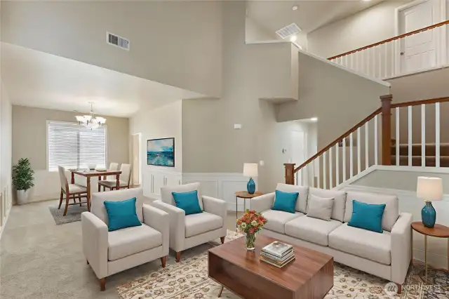 Large Formal Living Room with Formal Dining in the background. Virtually staged.