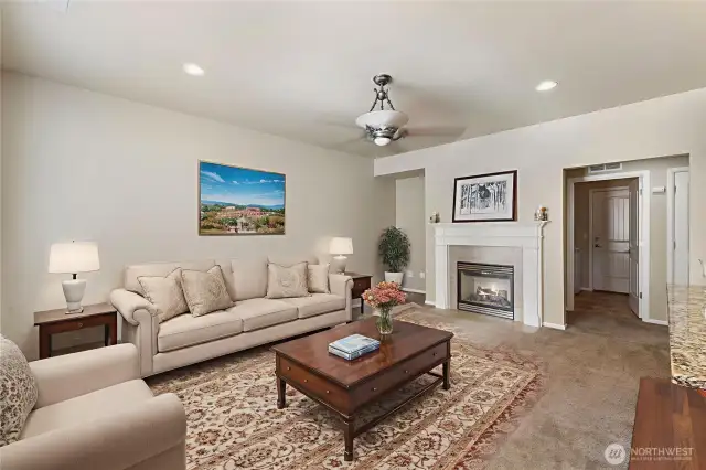 Large Family Room adjacent to the Kitchen. Gas fireplace adds charm and warmth. Virtually staged.