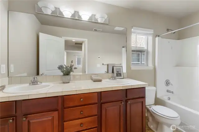 2nd floor full bath. Tile counter tops and flooring. Nice touch.