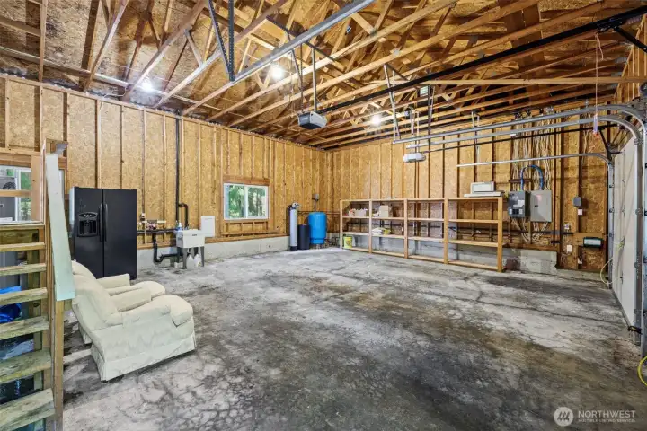 Huge garage with extra storage rack.