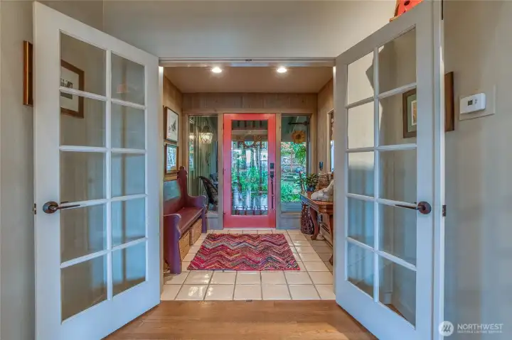 This view shows the large entrance area, looking out towards front door and main entrance.