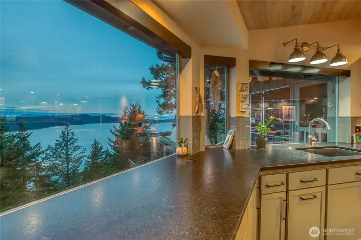 The chef's kitchen showcases water, mountain and island views from every window.