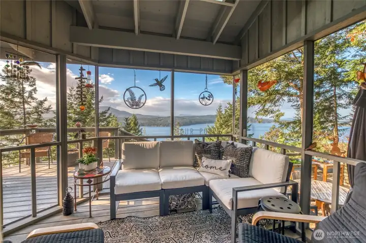 Enclosed deck off the kitchen area for cozy relaxing moments all year long. Overlooks East Sound and Turtleback Mountain. Views into Eastsound Village to the north and beyond.