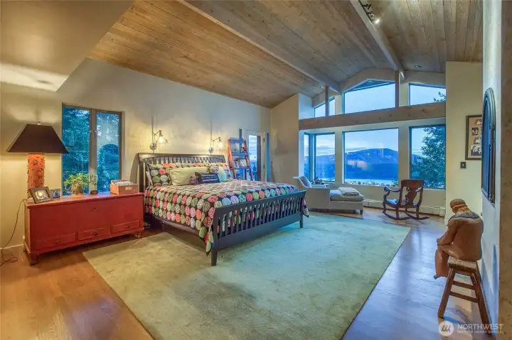 Main bedroom ensuite with sitting area overlooking Turtleback Mountain. 180 degree water views up and down East Sound.