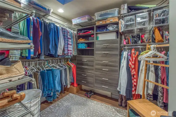 Main walk-in closet with plenty of built-ins.
