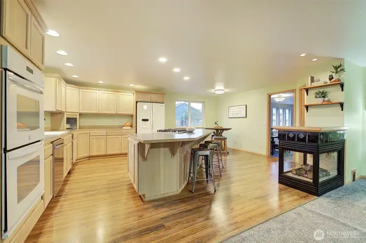 Kitchen with island and gas fireplace make this a great place to entertain as it is right next to the family room.