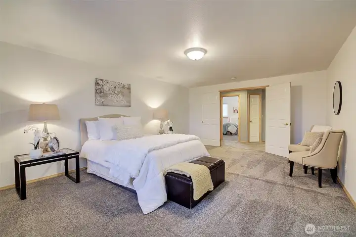 Large primary bedroom with double entry doors.