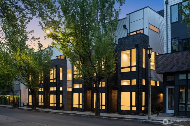 Evening glow highlights the clean lines and upscale façade — your sanctuary at the intersection of style and serenity.