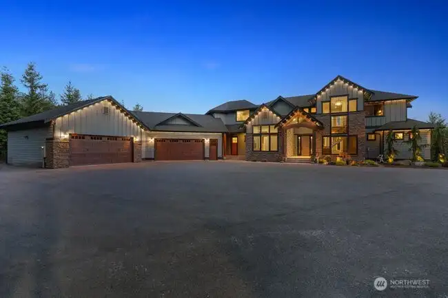 Spacious driveway leads you to an oversized 4-car garage and room for RV parking. Govee Smart lighting was installed in 2024. EV charger, RV parking, 50-amp generator.