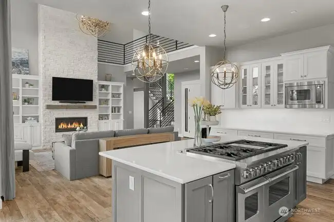 High end LVP Flooring, white quartz countertops as well as beautiful white cabinets.