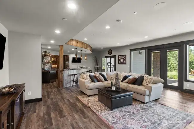 Spacious daylight basement entertaining space with a large bar, living space and enough room for a pool table and games. There is also a powder room, gym and two storage areas. Step out to a backyard fire pit for peaceful evenings.