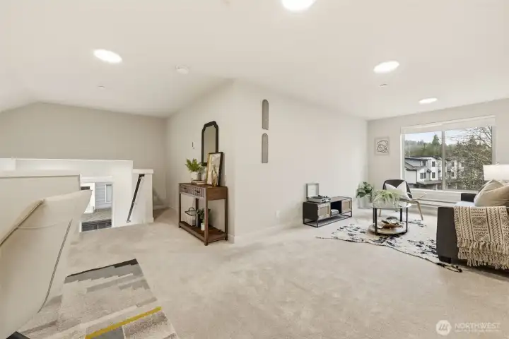 Expansive upstairs bonus room ideal as a fourth bedroom, media room, or office