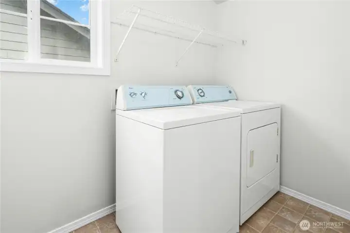 Convenient upstairs laundry room adds everyday ease and efficiency.