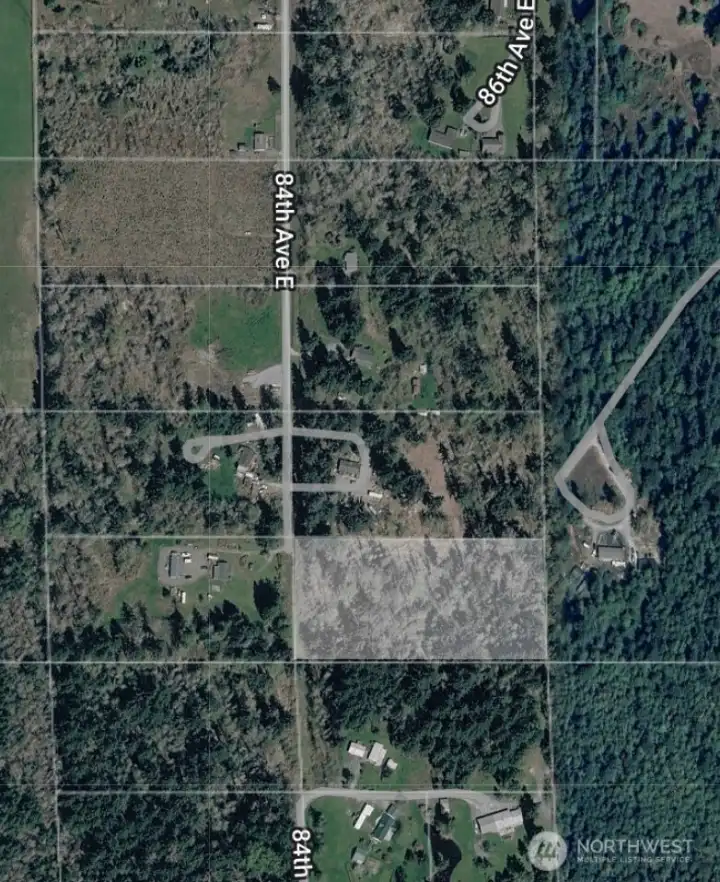 Parcel is faded out in picture to show in relationship to the neighborhood.