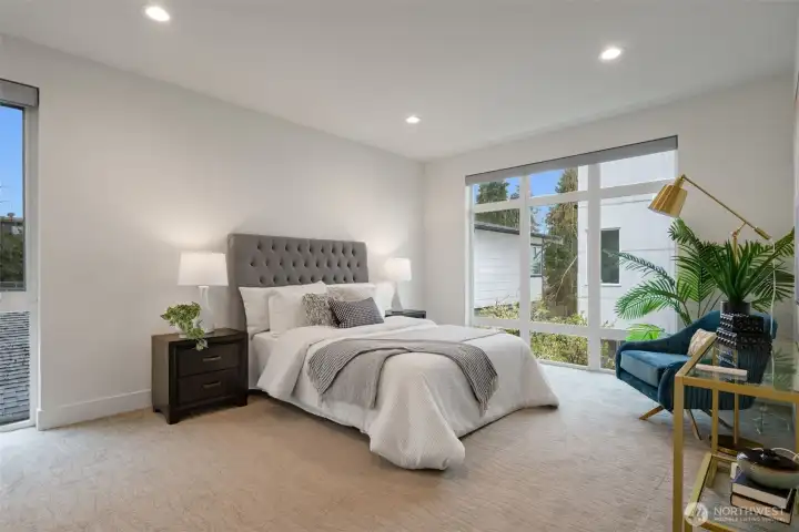 The generous primary bedroom, lives like a brand new home with all finishes very lightly lived in. Plenty of room for a king bed + large side tables + seating area.