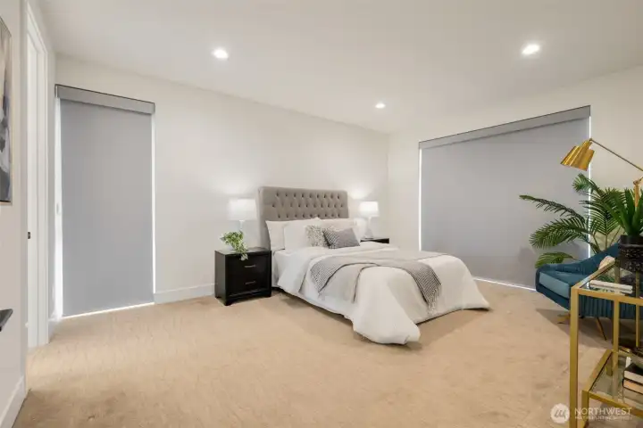 Remote Lutron blinds make it super cozy and hotel like inside the primary.