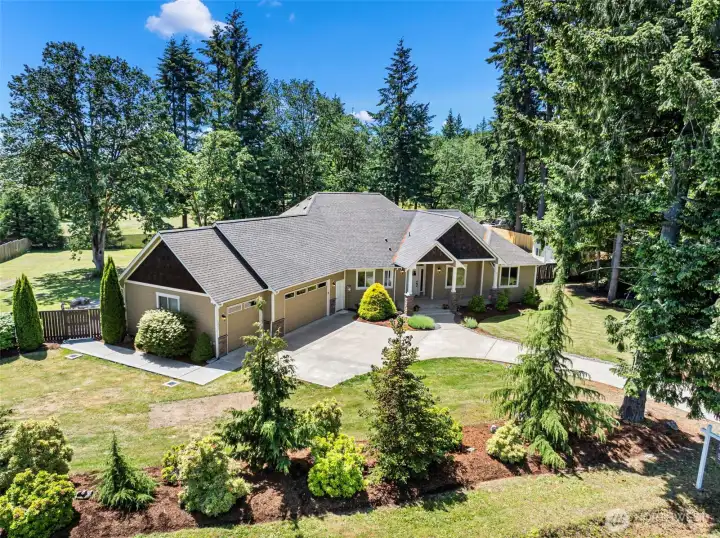 An incredible custom home placed in a park like setting.
