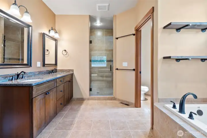 Gorgeous 5 piece primary suite feels tucked away and private.