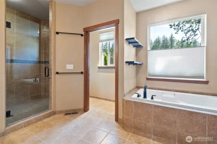Enjoy the dappled light coming through the bathroom window as you soak in the large tub. Or if baths aren't your thing, enjoy the large walk in shower!