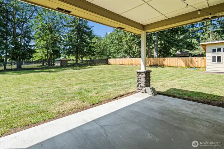 Large covered patio serves as a nice added living space even in not so nice weather.