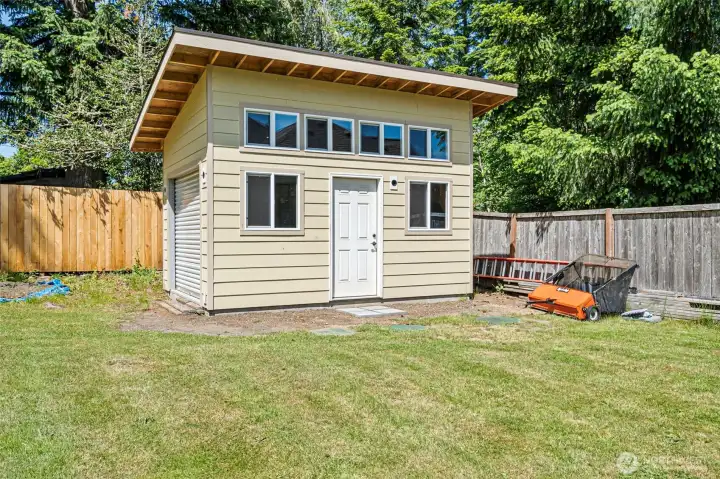 Enjoy a large shed with roll top door for ease of storage.