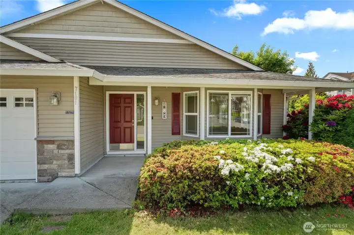 The welcoming exterior entry sets the tone for this charming Hawks Prairie rambler, featuring mature landscaping, blooming rhododendrons, and a covered approach that adds warmth and curb appeal. Situated on a spacious corner lot in the Raili May community, the home offers an inviting first impression with the ease and comfort of single level living. The welcoming exterior entry sets the tone for this charming Hawks Prairie rambler, featuring mature landscaping, blooming rhododendrons, and a covered approach that adds warmth and curb appeal. Situated on a spacious corner lot in the Raili May community, the home offers an inviting first impression with the ease and comfort of single level living.