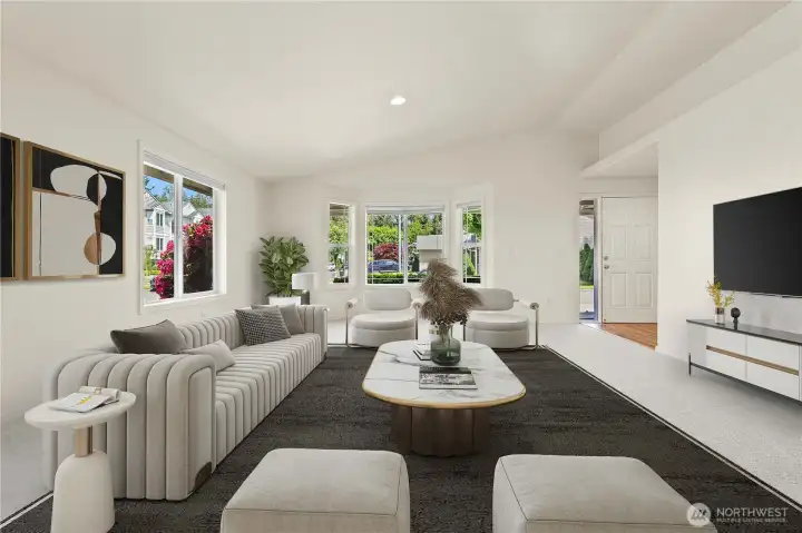 Virtually staged: living room shows all the possibilities! Step into a light-filled living space featuring vaulted ceilings, skylights, crisp white trim, and a large bay window that brings in beautiful natural light throughout the day. The open concept layout creates an inviting flow ideal for both everyday living and gathering with guests. Virtually staged: living room shows all the possibilities! Step into a light-filled living space featuring vaulted ceilings, skylights, crisp white trim, and a large bay window that brings in beautiful natural light throughout the day. The open concept layout creates an inviting flow ideal for both everyday living and gathering with guests.