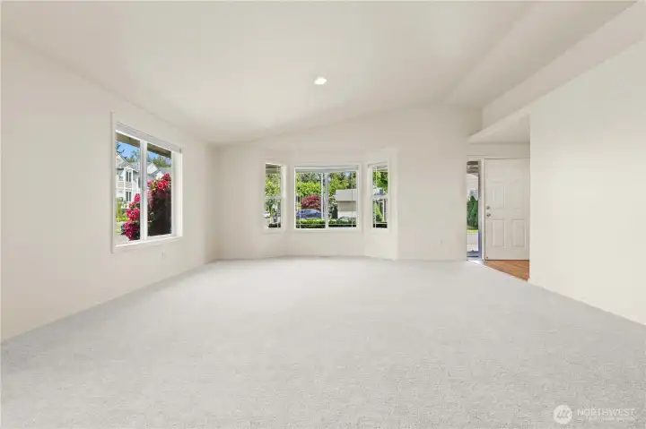 Living room is generous in size with large windows and a bay window overlooking your flowering plants Living room is generous in size with large windows and a bay window overlooking your flowering plants