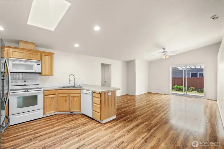 Designed with connection and functionality in mind, the kitchen opens comfortably to the dining and living spaces, creating an easy layout for entertaining and daily routines. Additional pantry storage, natural light, and seamless sightlines make this central living area feel both practical and welcoming. Designed with connection and functionality in mind, the kitchen opens comfortably to the dining and living spaces, creating an easy layout for entertaining and daily routines. Additional pantry storage, natural light, and seamless sightlines make this central living area feel both practical and welcoming.