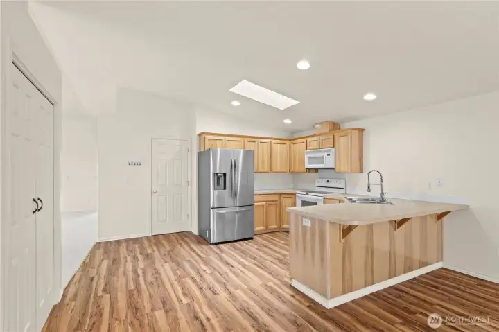 Designed with connection and functionality in mind, the kitchen opens comfortably to the dining and living spaces, creating an easy layout for entertaining and daily routines. Additional pantry storage, natural light, and seamless sightlines make this central living area feel both practical and welcoming. Designed with connection and functionality in mind, the kitchen opens comfortably to the dining and living spaces, creating an easy layout for entertaining and daily routines. Additional pantry storage, natural light, and seamless sightlines make this central living area feel both practical and welcoming.