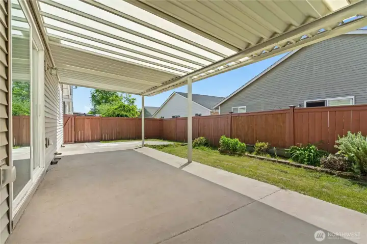 The fully fenced backyard offers a private outdoor setting with room for gardening, pets, or relaxing in the fresh PNW air. A covered patio creates the perfect space for year-round outdoor enjoyment, whether hosting friends or enjoying a quiet morning coffee. The fully fenced backyard offers a private outdoor setting with room for gardening, pets, or relaxing in the fresh PNW air. A covered patio creates the perfect space for year-round outdoor enjoyment, whether hosting friends or enjoying a quiet morning coffee.