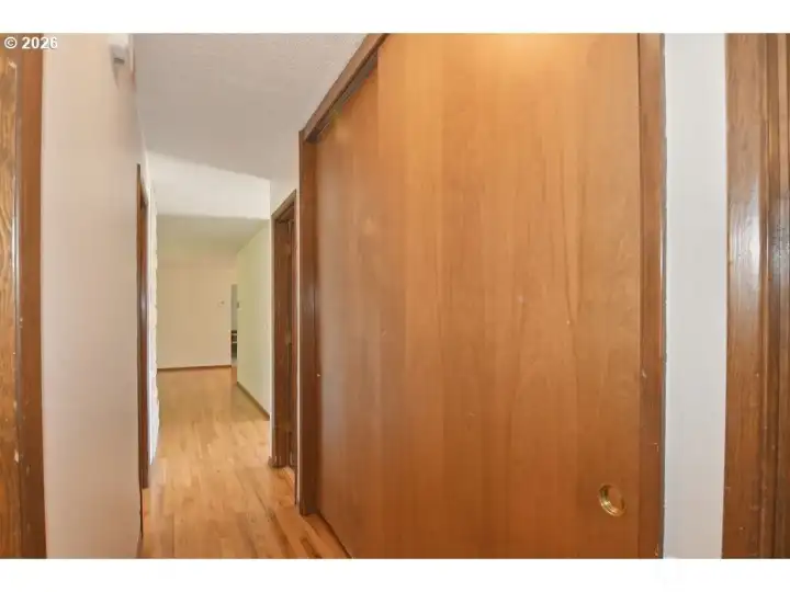 Hallway with storage closets.
