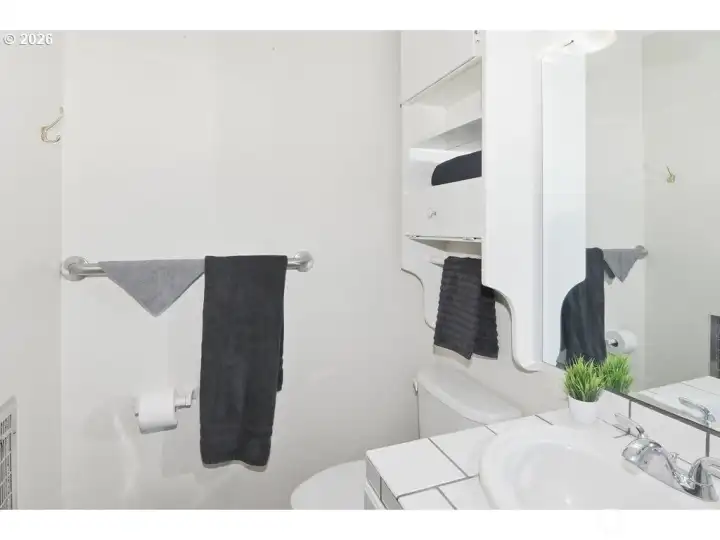Primary bedroom attached bathroom.