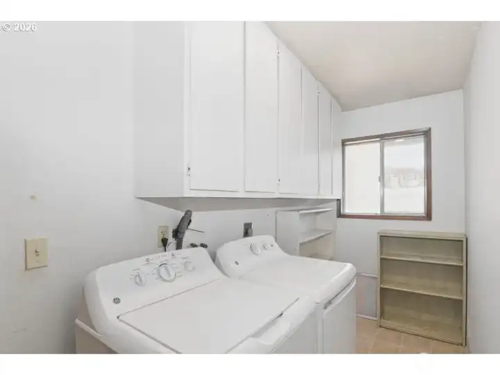 Utility room with washer and dryer.