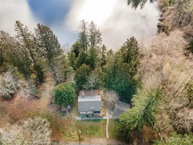 Another shot to show the additional lot the left of the house that has amazing potential for separate home, tiny home, you name it! With no HOA here you can do VRBO or Air BnB here as well.