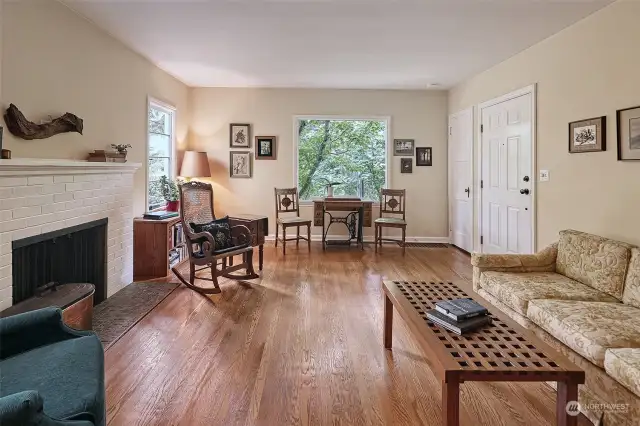 Gorgeous day room with gleaming hardwood floors.