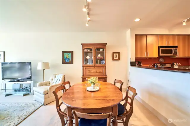 Spacious dining room perfectly positioned between kitchen and living room.