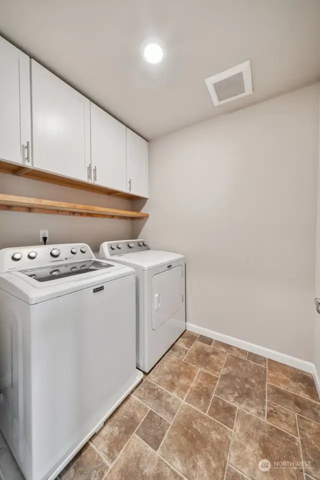 Laundry with cabinets
