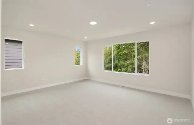 Primary suite with direct views of North Kitsap Heritage Park beyond.