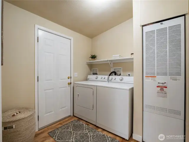 Utility room with washer/dryer, furnace and room to add a folding table, freezer, etc.