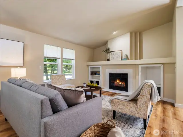The living room is the perfect gathering space with fireplace and built-ins for books, games and entertainment units.