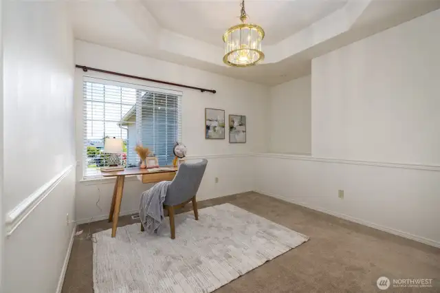 Extra room off of entry could be used as a home office or den.