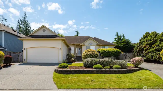 Home has a 2 car garage and a gated parking area for an RV or boat.