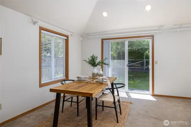 Sliding glass doors to backyard off of dining area provide easy access to the patio.
