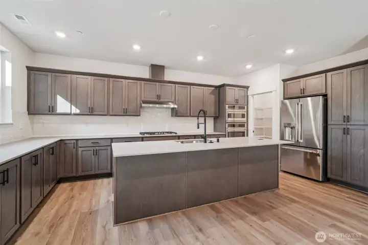 Pic is of similar home, layout and materials of surfaces may vary. Cabinets to be white in actual home.