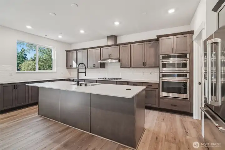 Pic is of similar home, layout and materials of surfaces may vary. Cabinets to be white in actual home.
