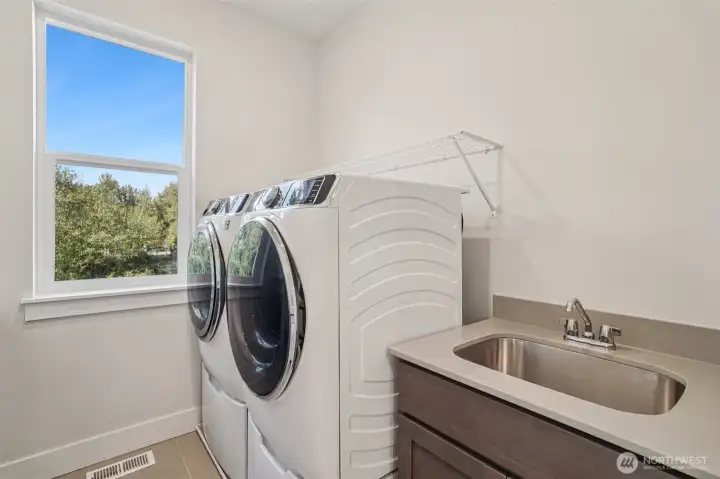 Pic is of similar home, layout and materials of surfaces may vary.  Cabinets to be white in actual home.