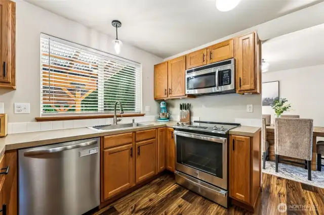 Kitchen view into dining, love the huge window!